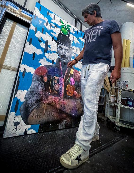 Angelo Accardi next to his art