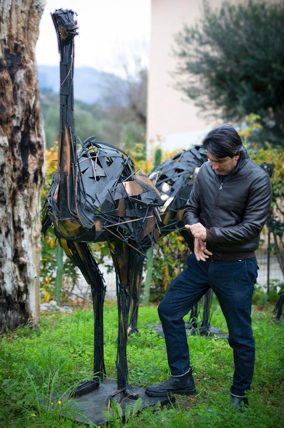  Angelo Accardi next to his art -Black Ostrich Bob Tail Riding 